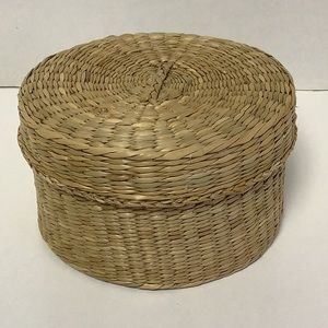 Round handwoven lidded sea grass basket